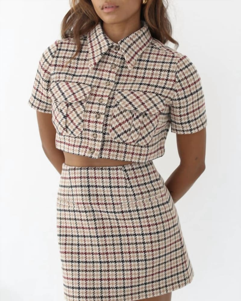 Front of a model wearing a size L Coco Mini Skirt In Newbury Plaid Tweed in Newbury Plaid Tweed by Rumored. | dia_product_style_image_id:352049